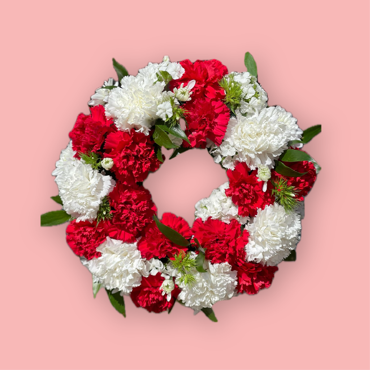 Coroană funerară cu garoafe roșii și albe - livrare flori în Reșița