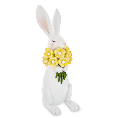 Figurină decorativă iepuraș cu flori în brațe, simbol al primăverii, gingășiei și bucuriei sărbătorilor de Paște. Este ideală pentru decorul casei, mese festive sau vitrine decorative. Perfectă ca dar de sezon pentru familie sau copii.