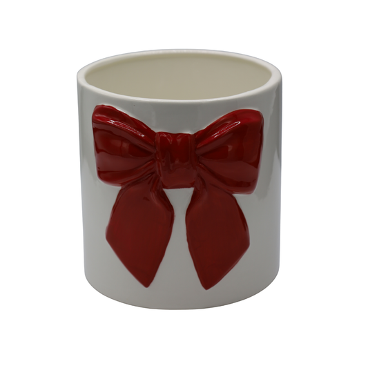 Ghiveci decorativ realizat din ceramică albă cu detalii roșii tip fontă, ideal pentru plante decorative, flori sau suculente. Designul elegant și contrastul cromatic oferă personalitate și stil oricărui spațiu interior și completează armonios decorurile moderne, romantice sau creative. Este perfect pentru living, bucătărie, dormitor sau birou și poate fi oferit drept cadou la casă nouă, aniversări sau pentru iubitorii de plante și accesorii decorative elegante.