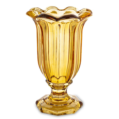 Vază din sticlă masivă cu picior galben, ideală pentru decor vibrant, modern și plin de energie. Este perfectă pentru flori mari sau aranjamente decorative spectaculoase. Adaugă un accent colorat și vesel în living, dining sau spații creative.