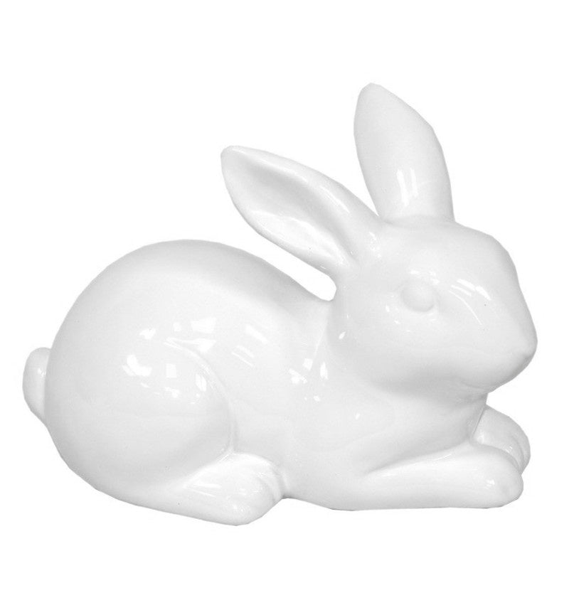 Figurină decorativă iepuraș alb din ceramică, ideală pentru decor de Paște și primăvară. Este o piesă minimalistă și elegantă care adaugă un aer curat și festiv în casă. Perfectă pentru mese festive, rafturi decorative sau cadouri sezoniere pentru familie și prieteni.