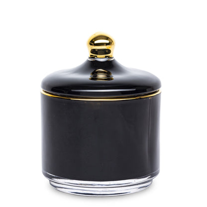 Bombonieră elegantă din sticlă negru cu detalii aurii, perfectă pentru depozitarea bomboanelor sau ca obiect decorativ premium. Este ideală pentru living, dining sau birou, adăugând un accent luxos și sofisticat. Perfectă ca dar de casă nouă sau aniversări.