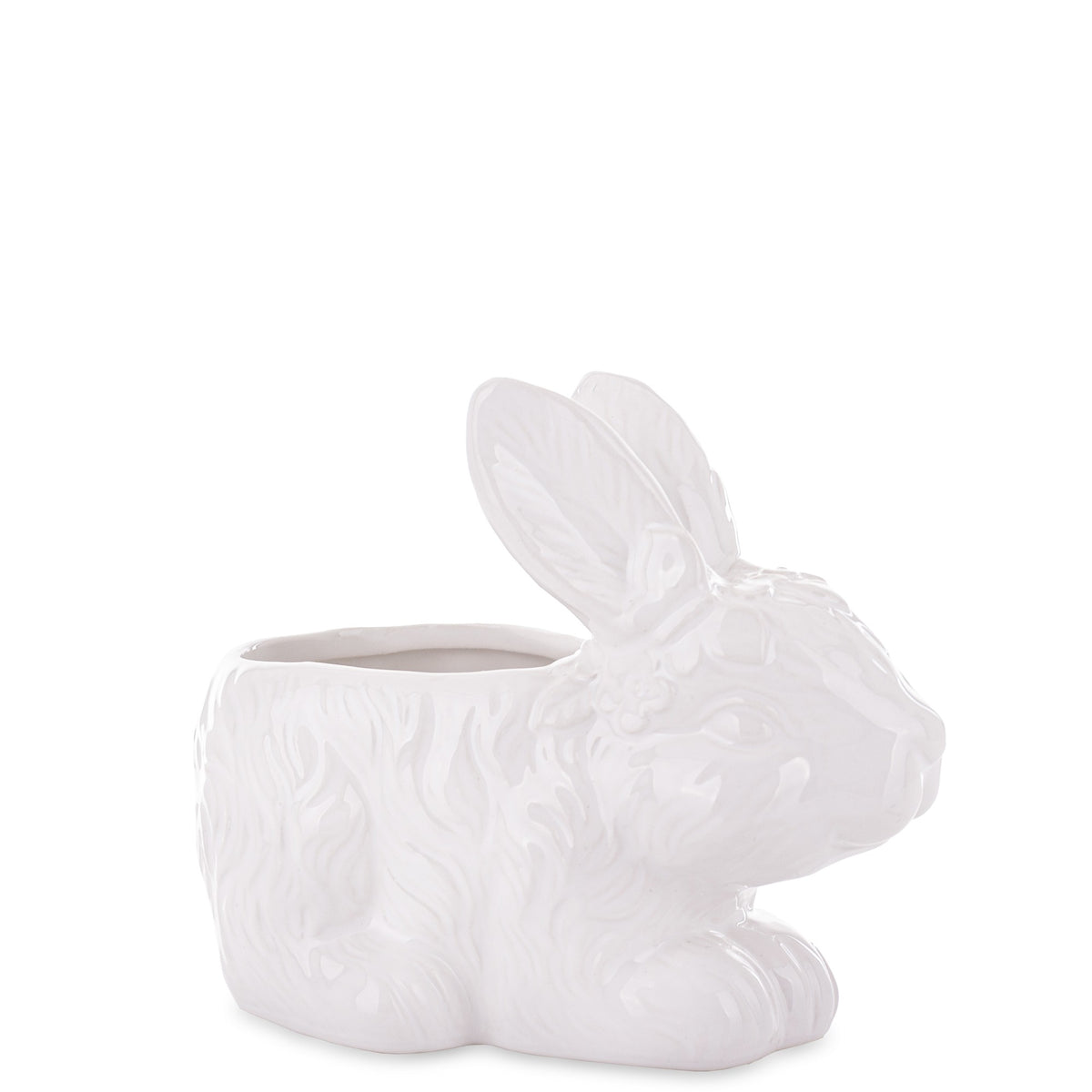 Ghiveci decorativ din ceramică albă cu design iepure, ideal pentru plante mici, suculente sau decor de Paște și primăvară. Este o piesă veselă și luminoasă care aduce un aer cald în orice spațiu. Perfect ca decor sau cadou sezonier pentru familie sau casă nouă.