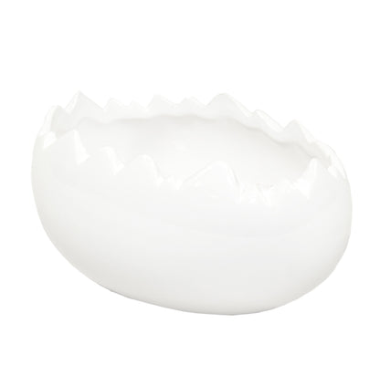 Ghiveci decorativ din ceramică albă în formă de ou, ideal pentru plante mici, decor de Paște sau aranjamente creative de primăvară. Este o piesă minimalistă și elegantă care adaugă un aer curat și festiv în orice spațiu. Perfect ca dar sezonier.