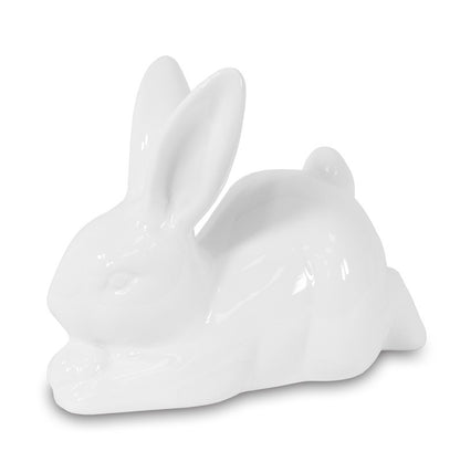 Figurină decorativă iepuraș alb din ceramică, ideală pentru decor de Paște și primăvară. Este o piesă minimalistă și elegantă care adaugă un aer curat și festiv în casă. Perfectă pentru mese festive, rafturi decorative sau cadouri sezoniere pentru familie și prieteni.