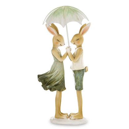 Figurină decorativă cu iepurași sub umbrelă, simbol al protecției, familiei și gingășiei. Este o piesă adorabilă de decor de Paște și primăvară, care aduce emoție și poveste în orice spațiu. Perfectă pentru decorul casei, mese festive sau cadou pentru copii și familie în perioada sărbătorilor.