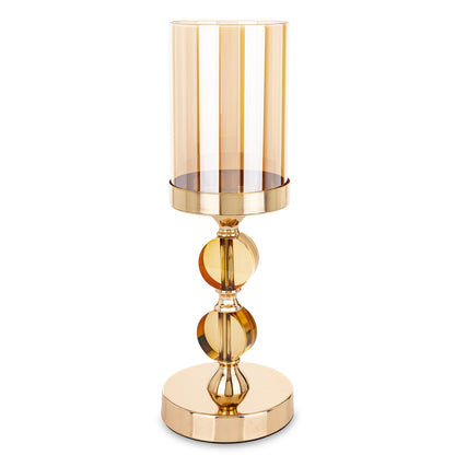 Sfeșnic decorativ elegant cu structură aurie și 2 discuri din sticlă fumurie, creat pentru a adăuga rafinament și lumină ambientală oricărui spațiu. Jocul dintre metalul auriu și sticla fumurie creează un efect vizual sofisticat și modern. Este ideal pentru living, dining sau evenimente speciale și reprezintă un cadou premium pentru casă nouă, aniversări sau decor festiv elegant.