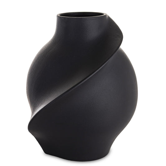 Vază din porțelan negru cu design minimalist modern, ideală pentru interioare sofisticate și elegante. Creează un contrast puternic și rafinat, fiind perfectă pentru flori simple sau aranjamente contemporane. Este o piesă statement pentru living, birou sau spații premium.