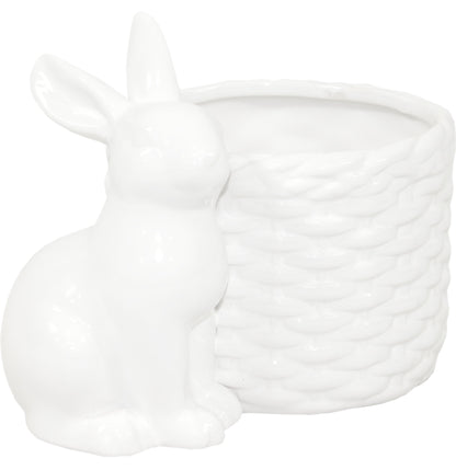 Ghiveci decorativ din ceramică albă cu design iepure, ideal pentru plante mici, suculente sau decor de Paște și primăvară. Este o piesă veselă și luminoasă care aduce un aer cald în orice spațiu. Perfect ca decor sau cadou sezonier pentru familie sau casă nouă.