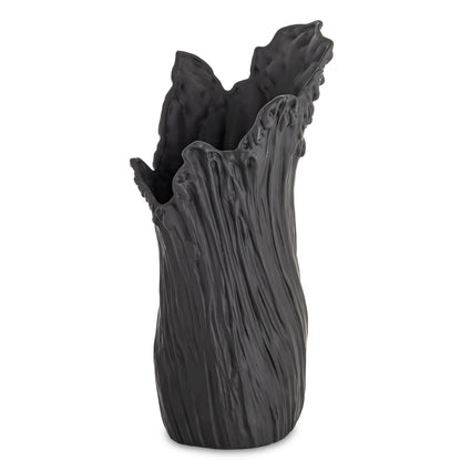 Vază din porțelan negru cu design minimalist modern, ideală pentru interioare sofisticate și elegante. Creează un contrast puternic și rafinat, fiind perfectă pentru flori simple sau aranjamente contemporane. Este o piesă statement pentru living, birou sau spații premium.